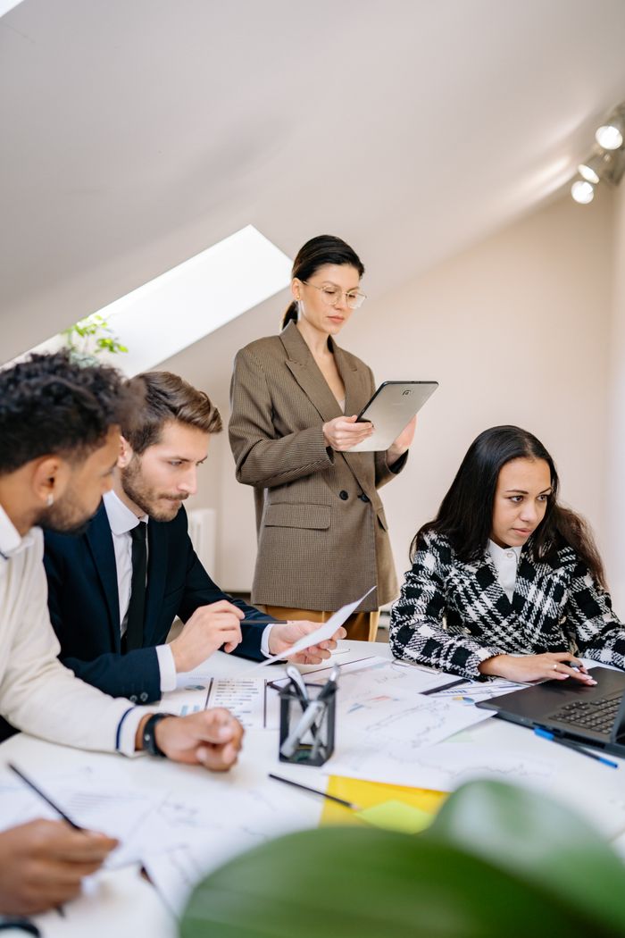 The Art of Drawing Readers In: Your attractive post title goes here A diverse team working together in a bright office space, collaborating on a project.